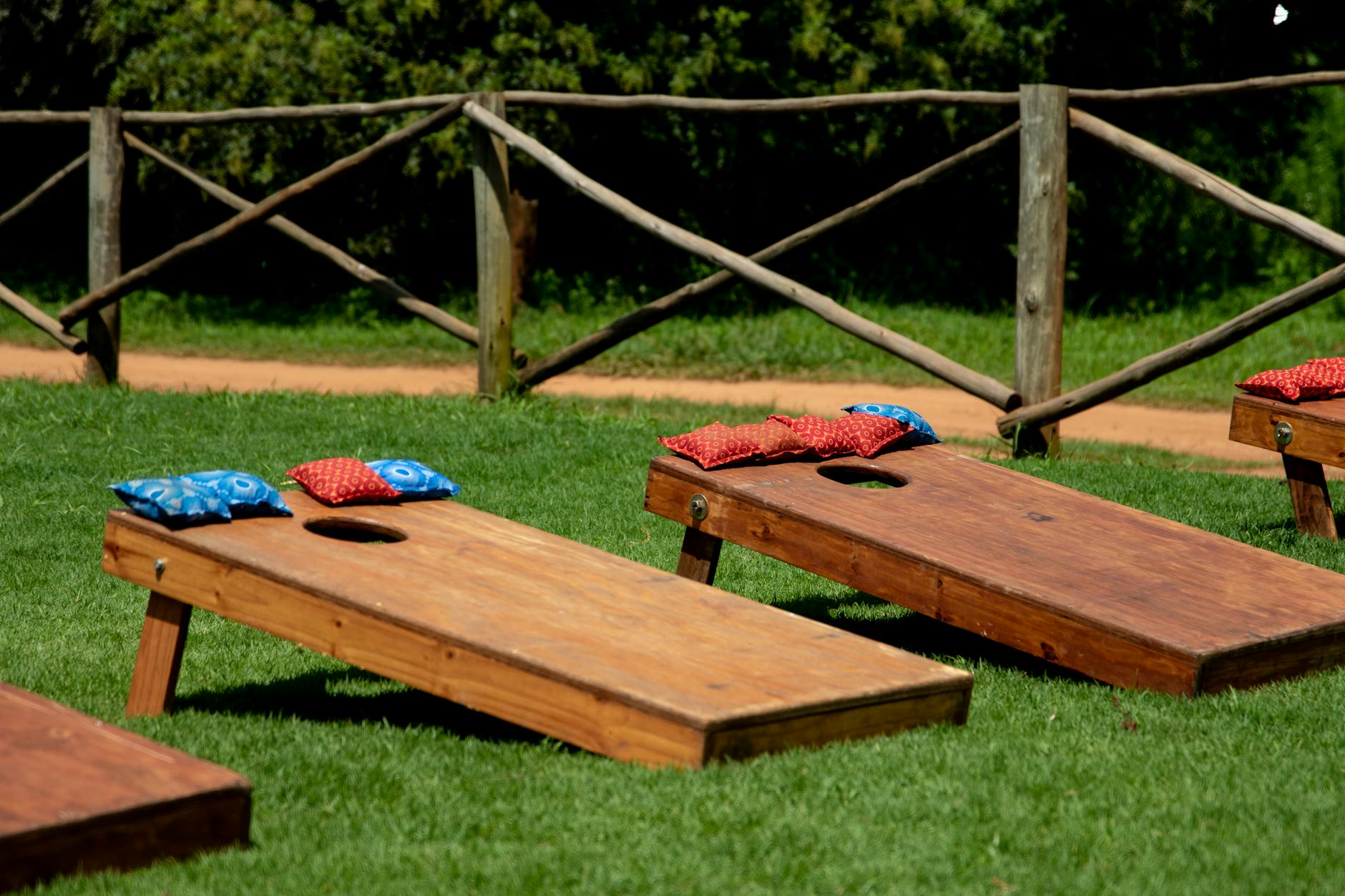 a set of wooden massage beds on a lawn
